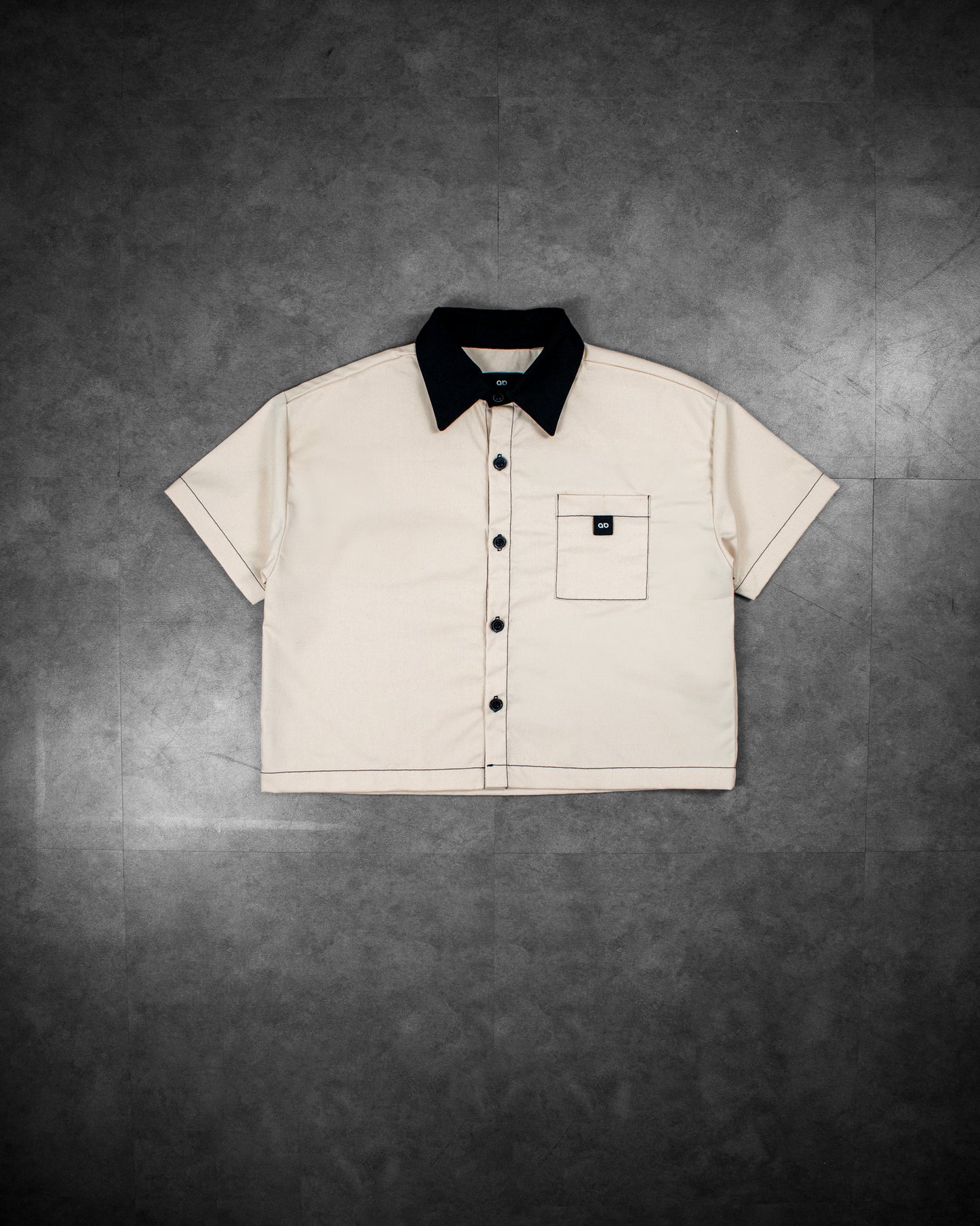 cropped polo shirt | button-down | drop shoulder | dual-tone and box fit | classic twill | crème