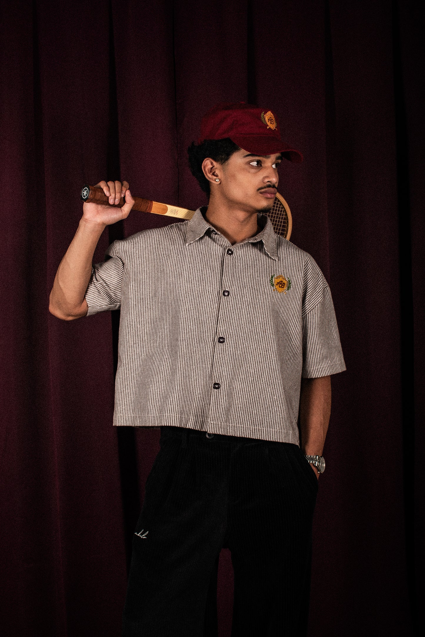 boxy cropped polo shirt | athletics club in umber stripes