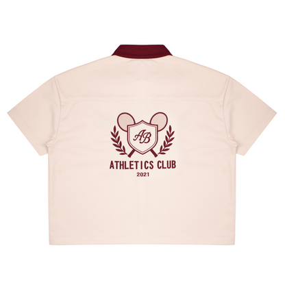boxy polo shirt | athletics club in crème & rosewood