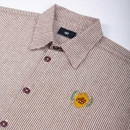 boxy cropped polo shirt | athletics club in umber stripes
