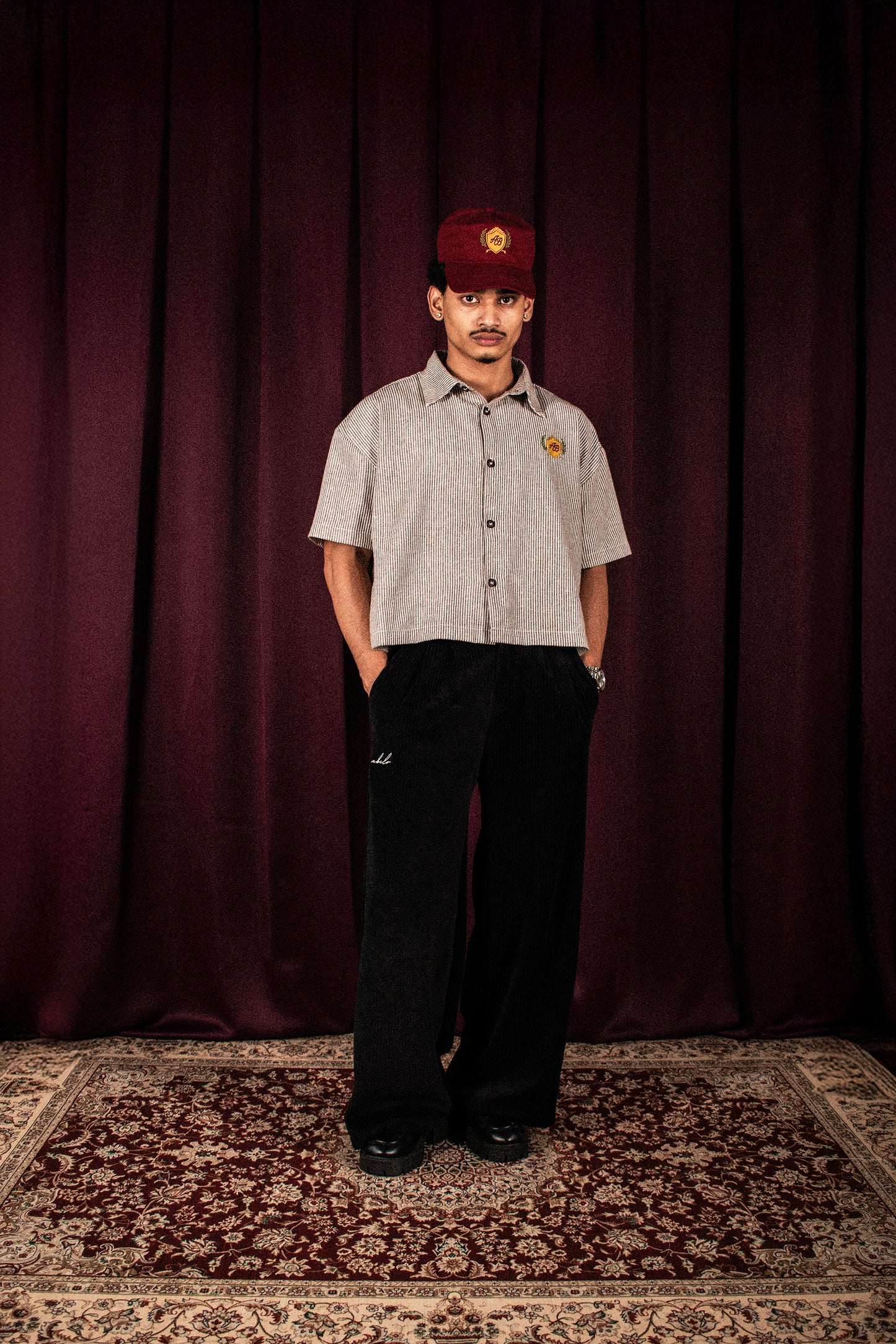 boxy cropped polo shirt | athletics club in umber stripes